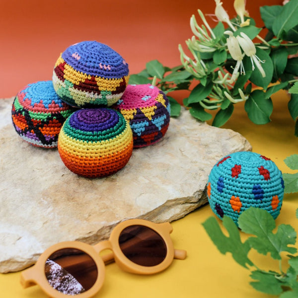 Lifestyle picture of multi-colored hacky sacks